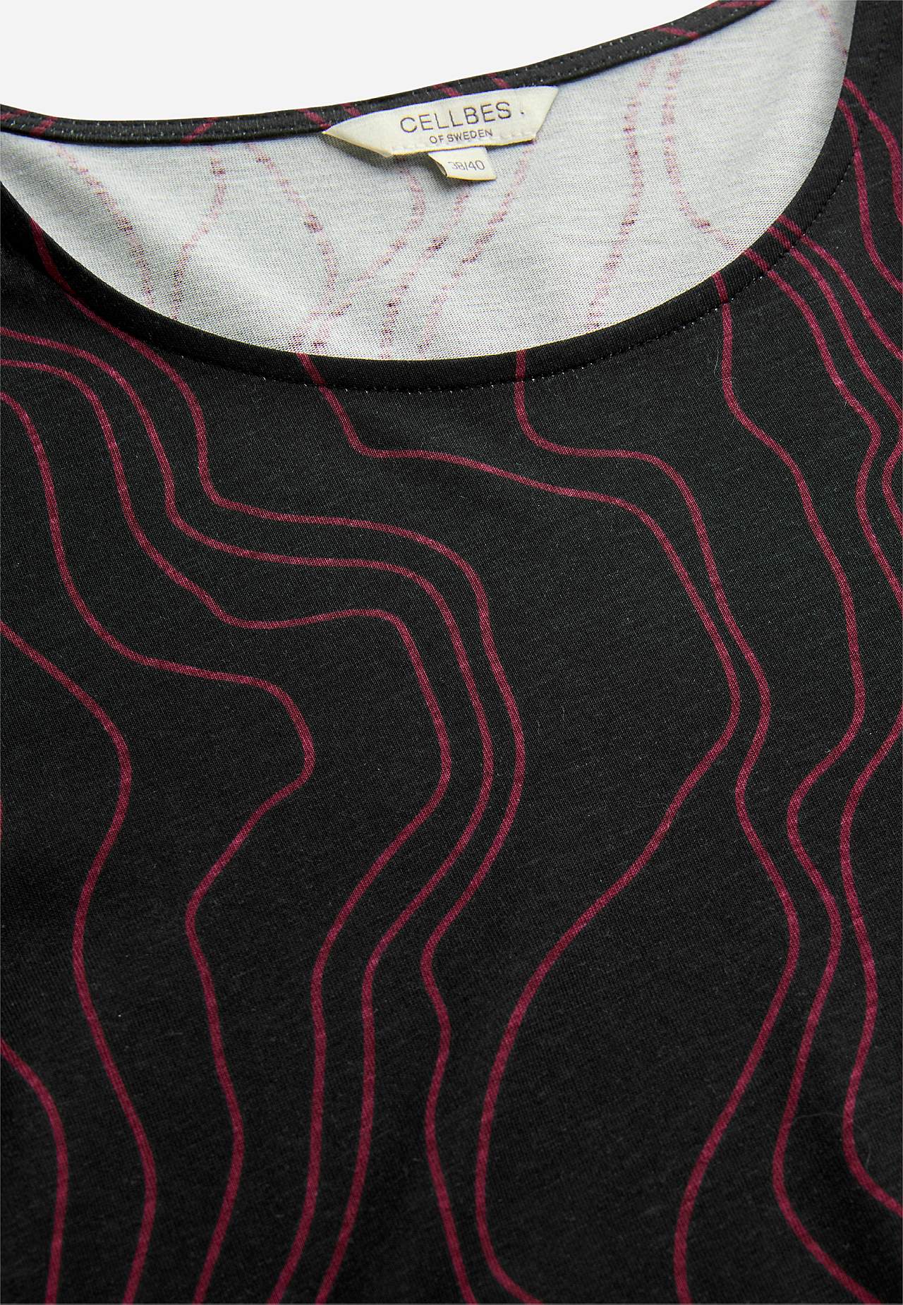 Kuviollinen trikootunika taskuilla