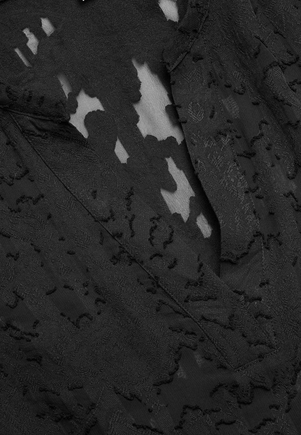 Jacquard-neuloksinen, läpikuultava pusero