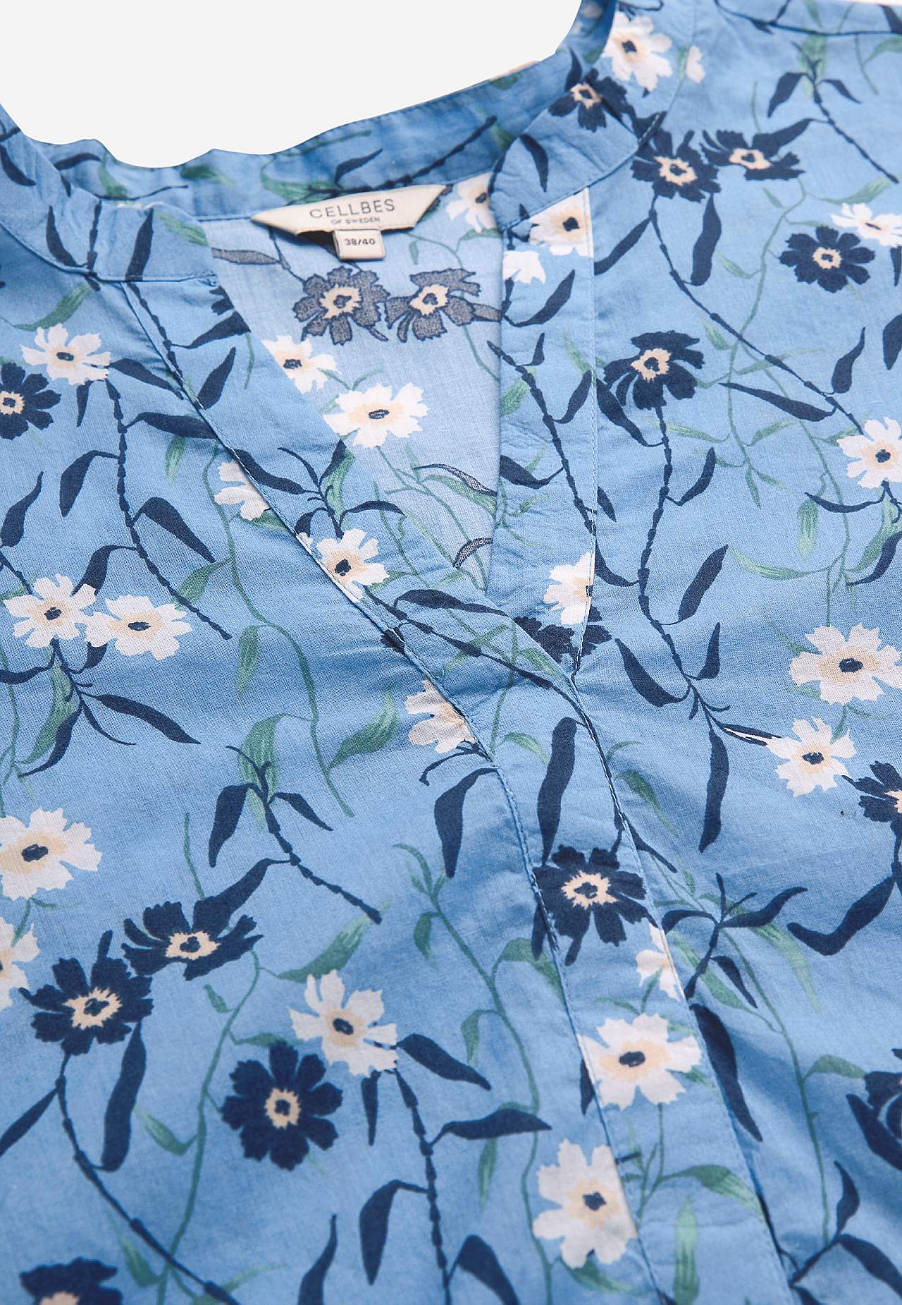 Kukkakuvioinen, kudottu tunika