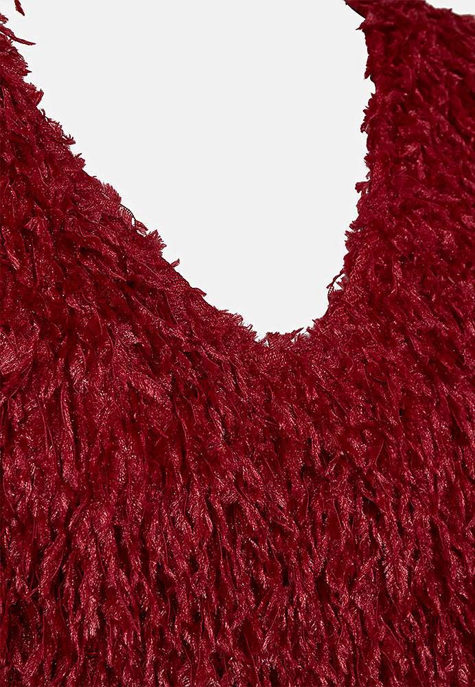 Juhlatoppi höyhenenkaltaisella materiaalilla