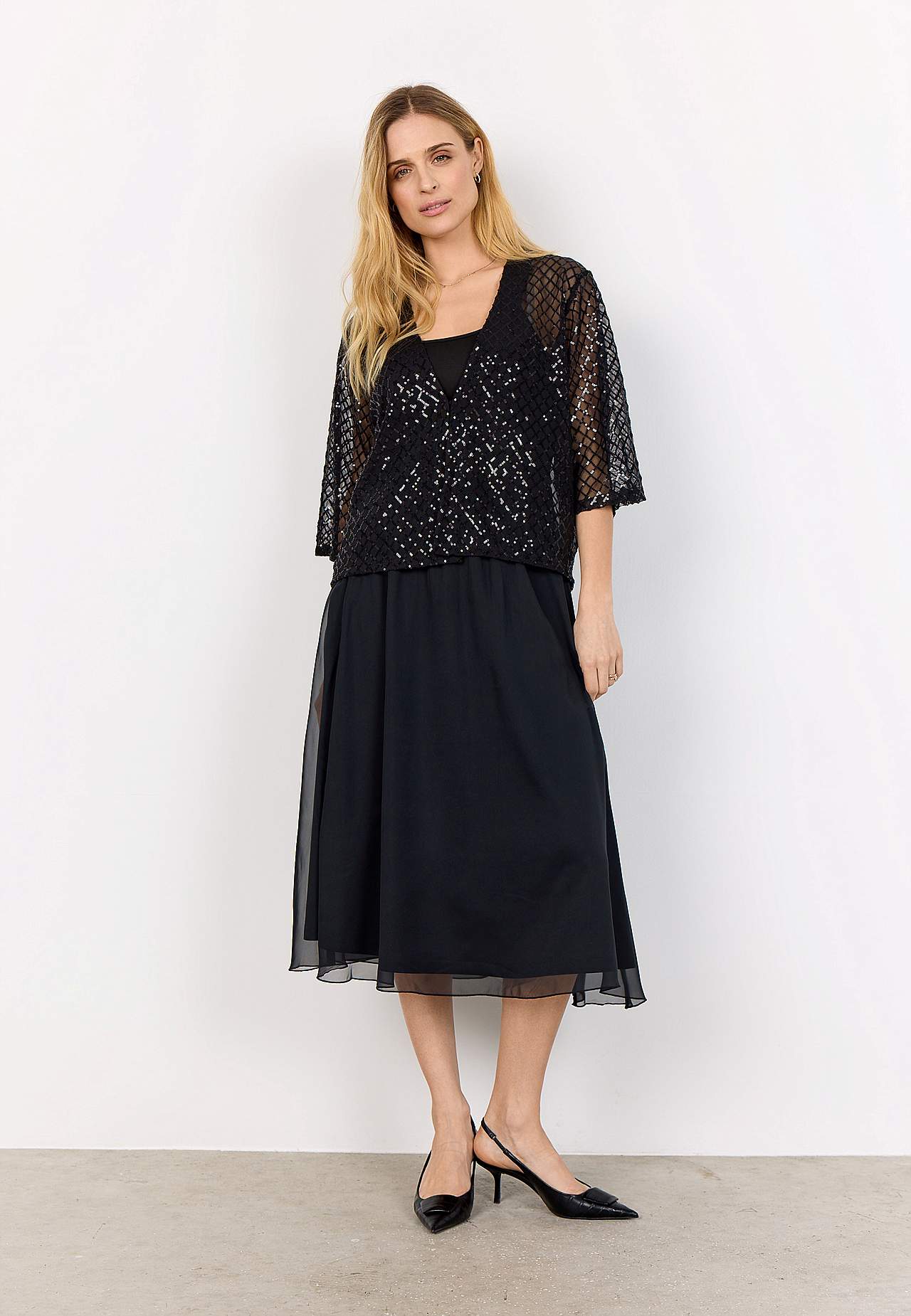 Tyylikäs sisätakki paljeteilla