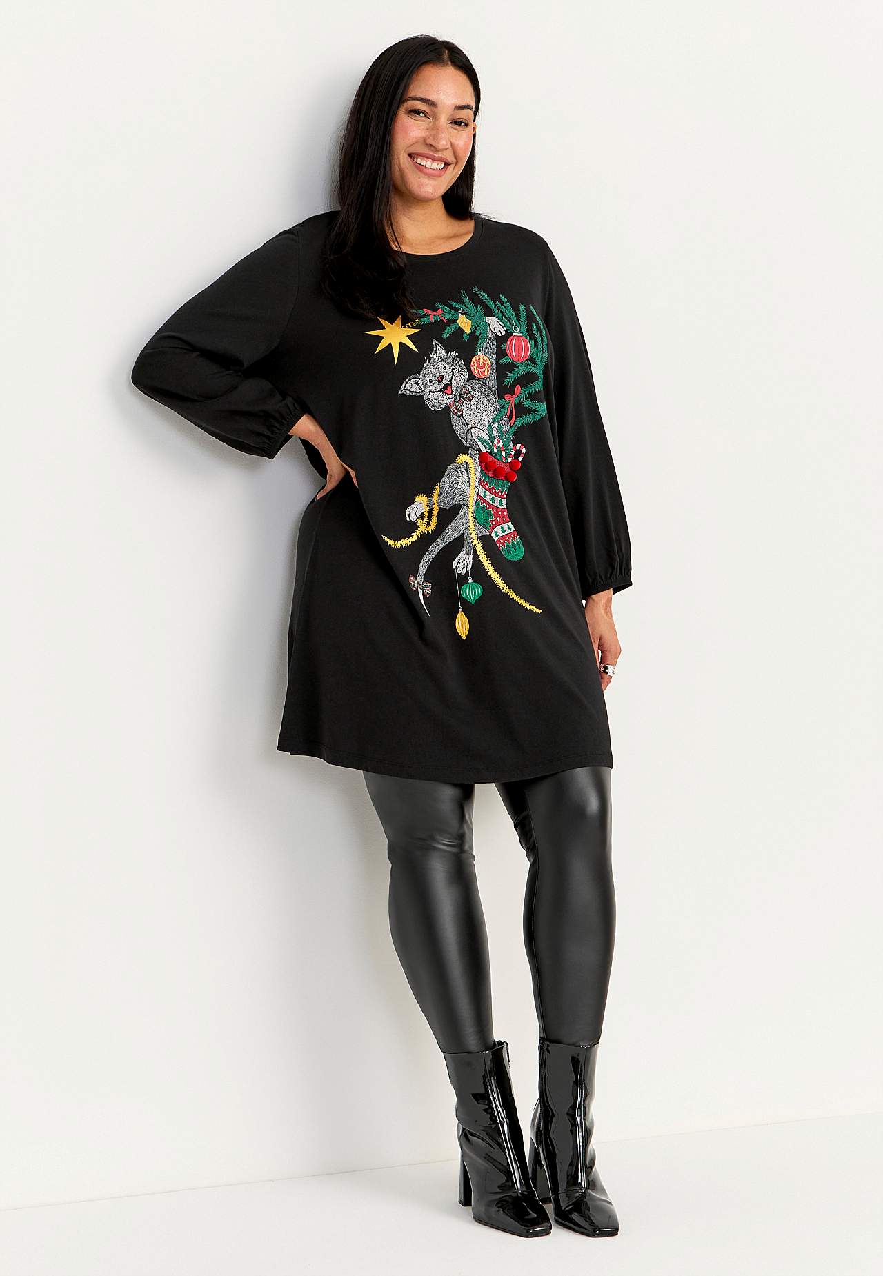 Trikootunika kissamotiivilla