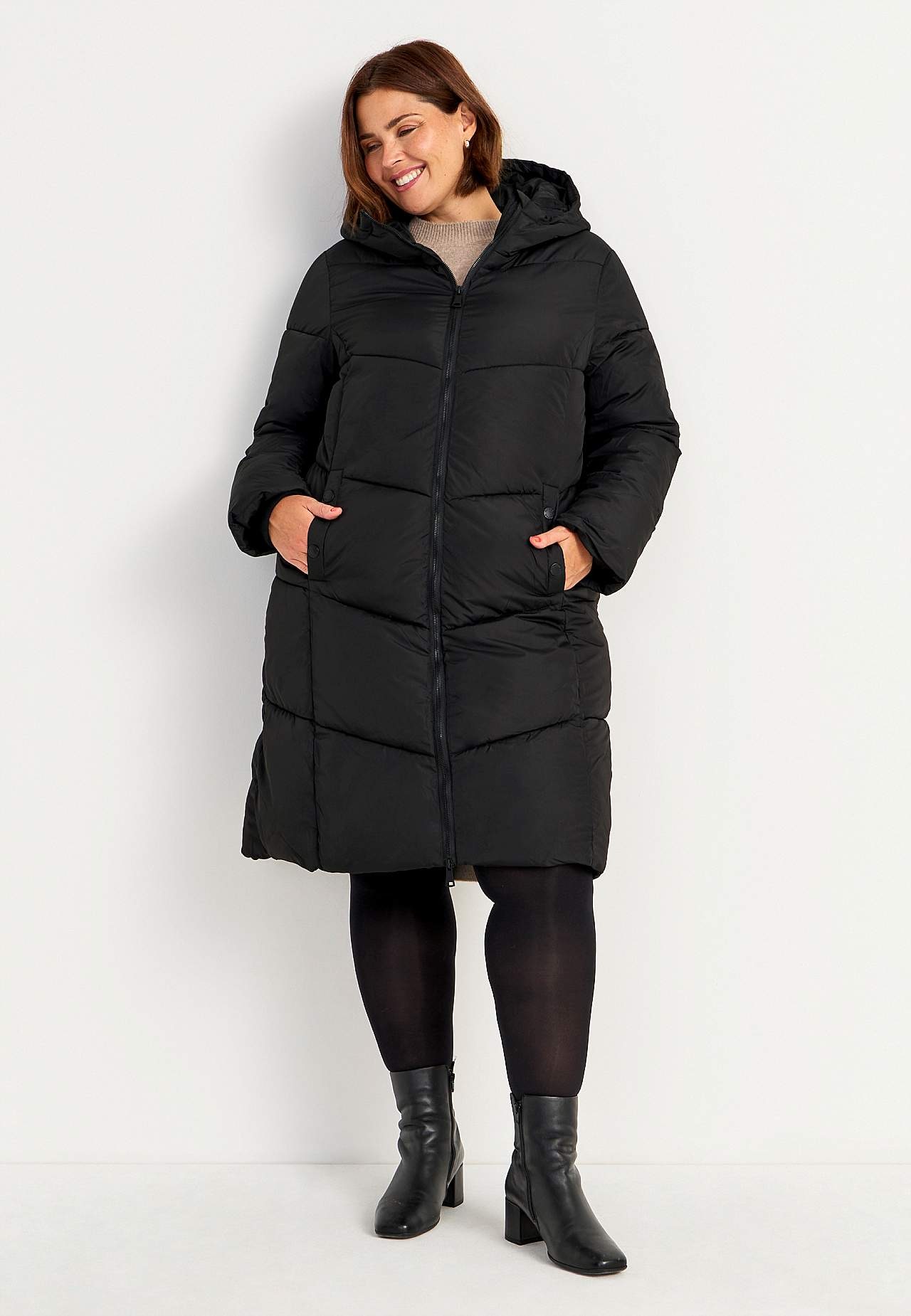 Pitkä takki pörröisellä toppauksella