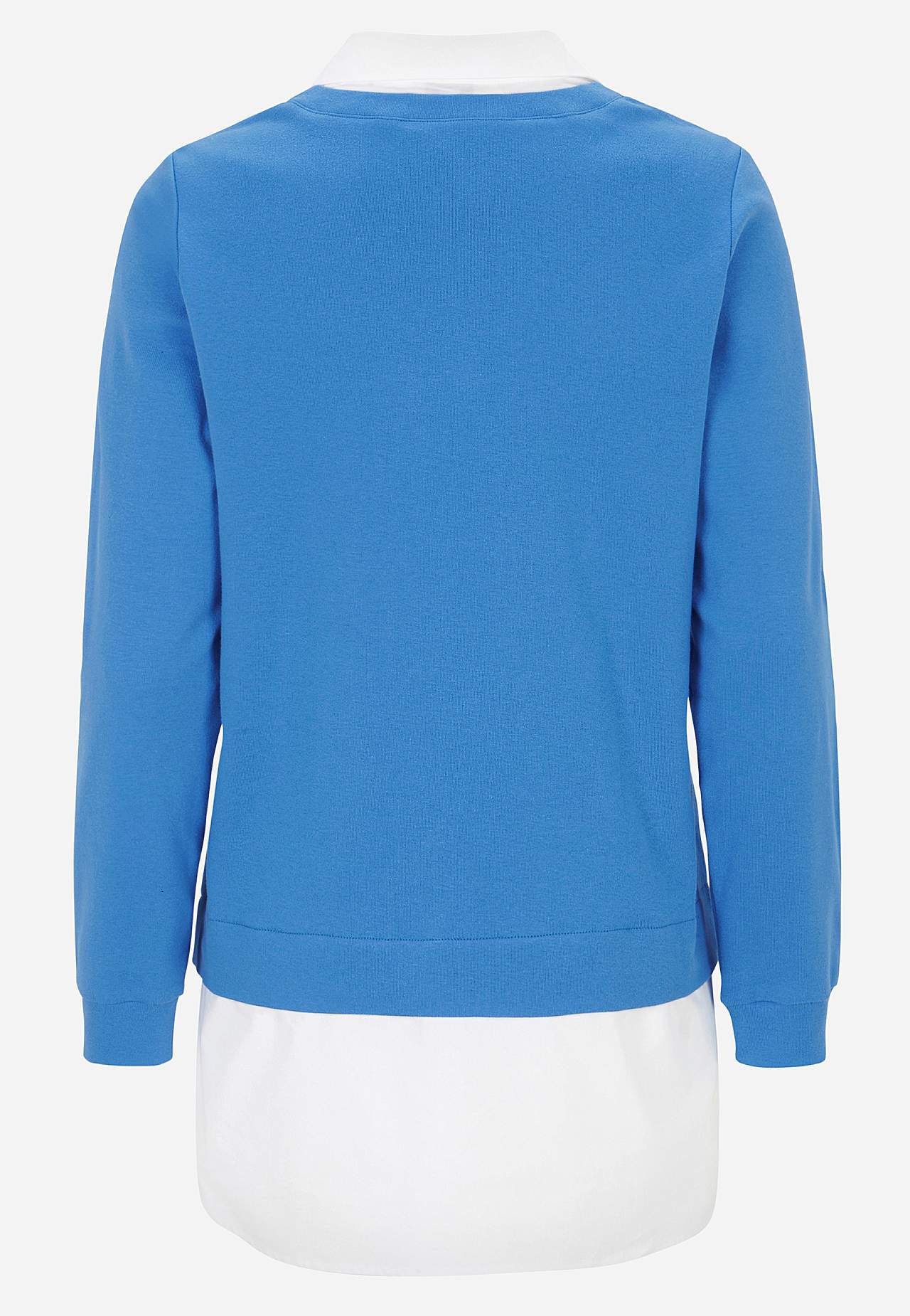 Trikootoppi kiinniommellulla paidan kauluksella