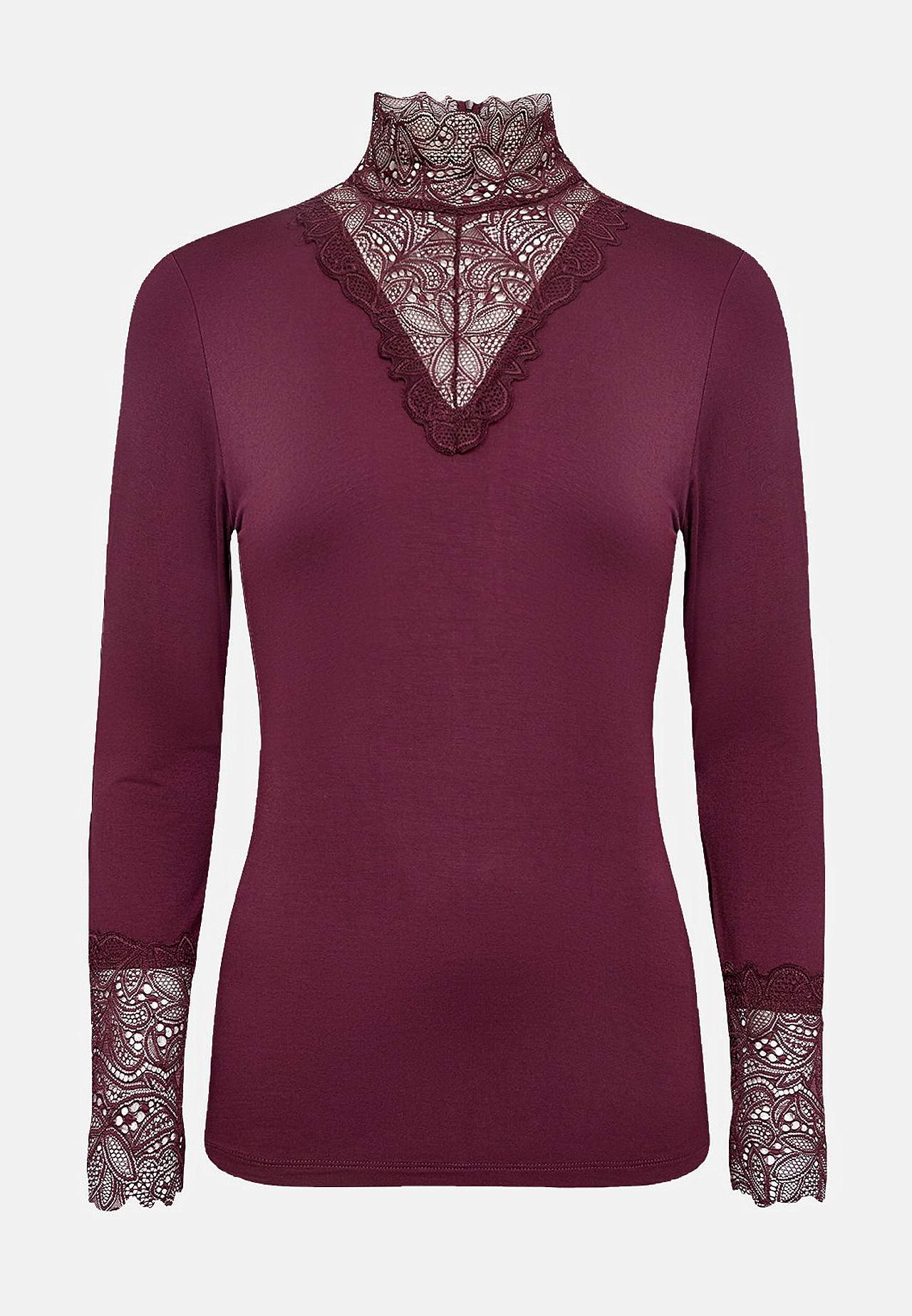 Trikootoppi pitsiyksityiskohdilla