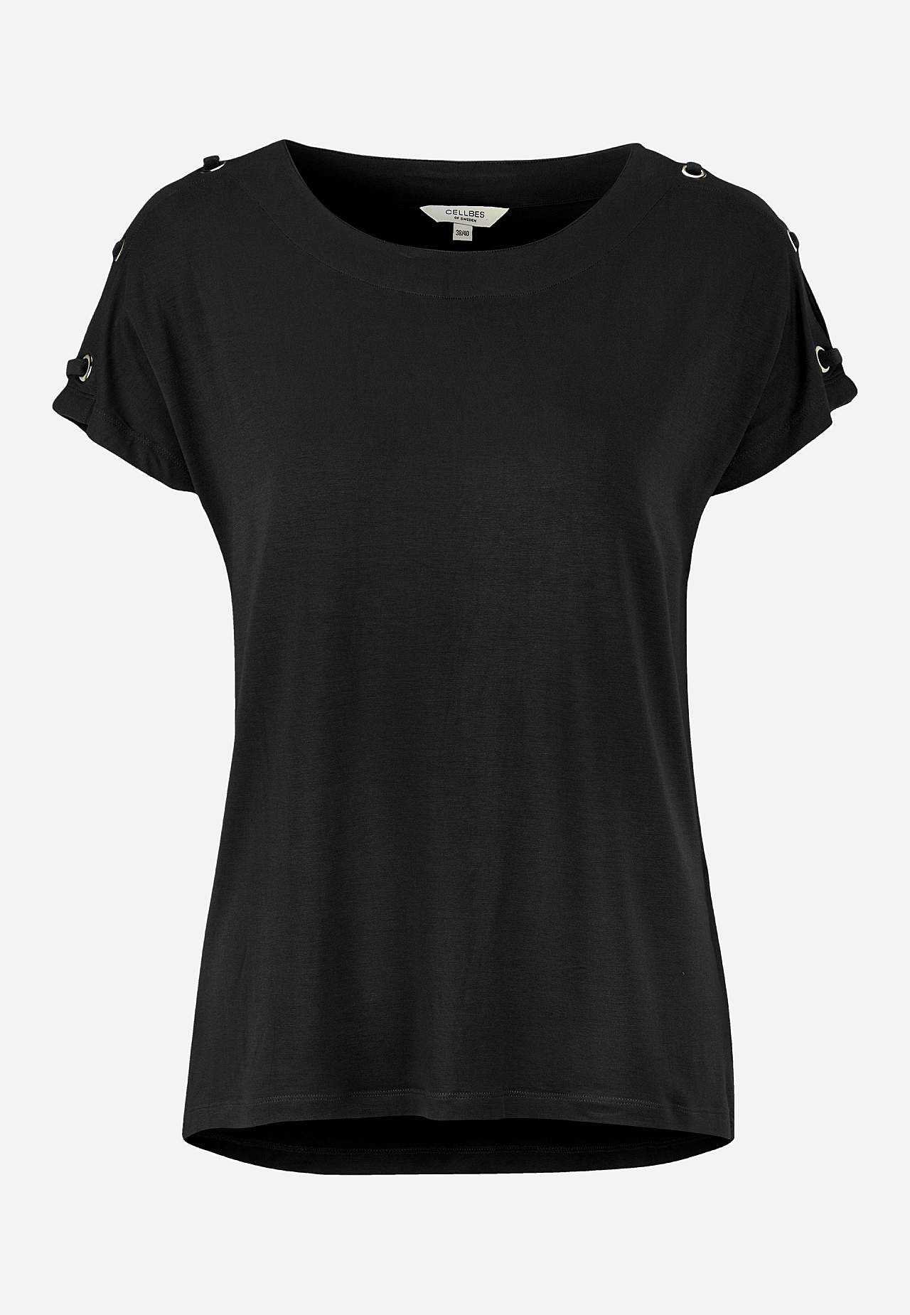 Trikootoppi sisustuksella olkapäässä