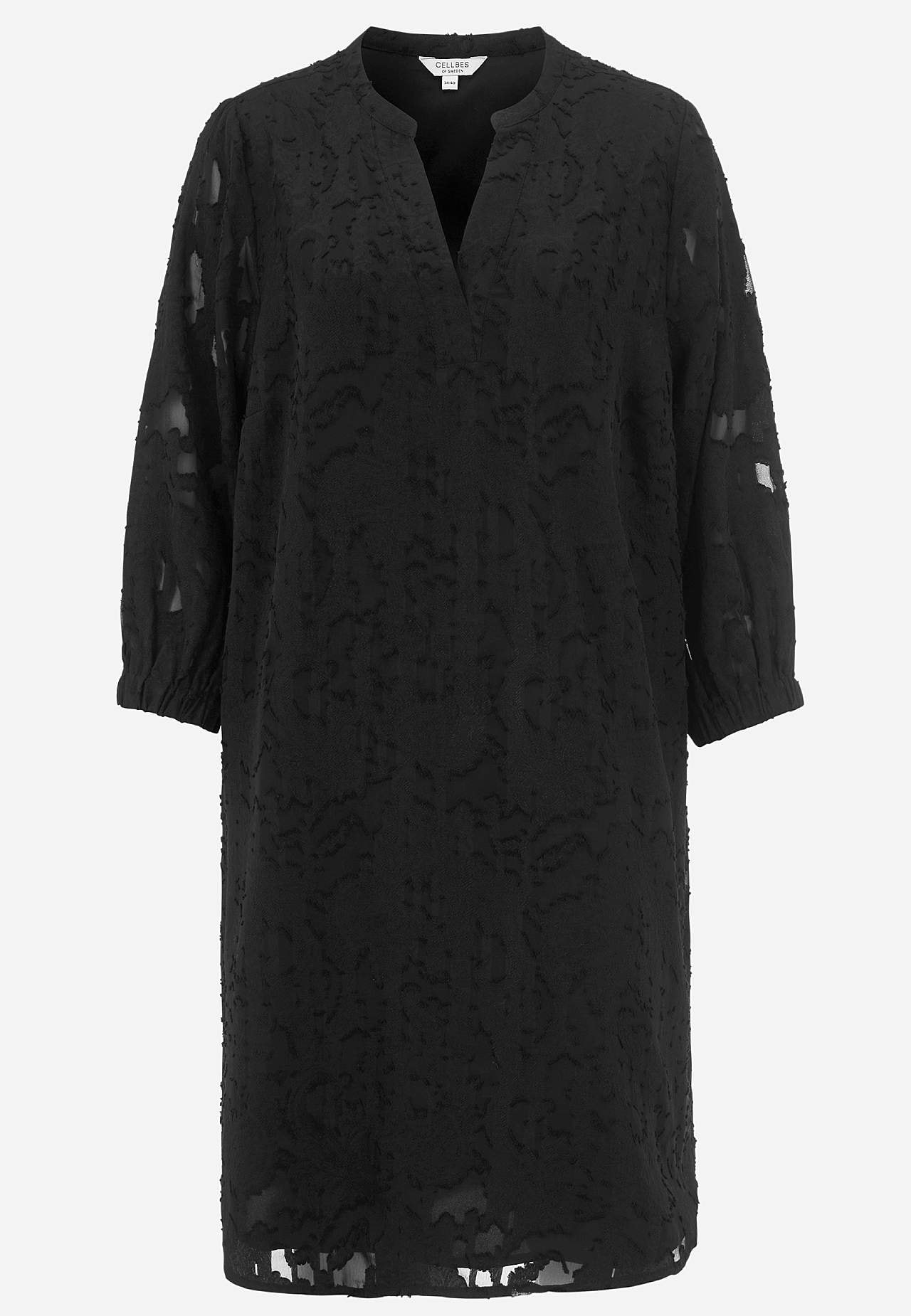 Jacquard-neuloksinen, läpikuultava mekko