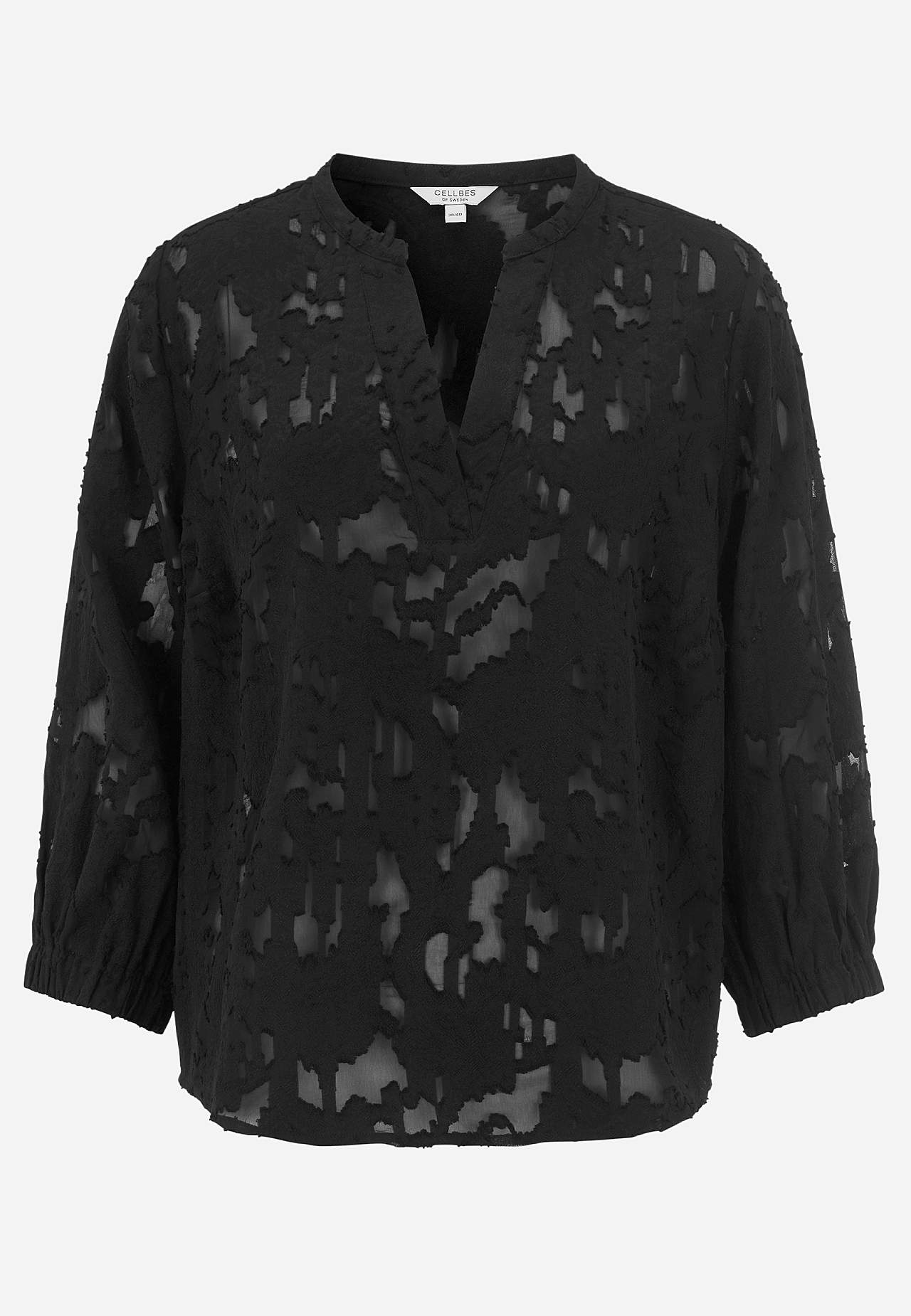 Jacquard-neuloksinen, läpikuultava pusero