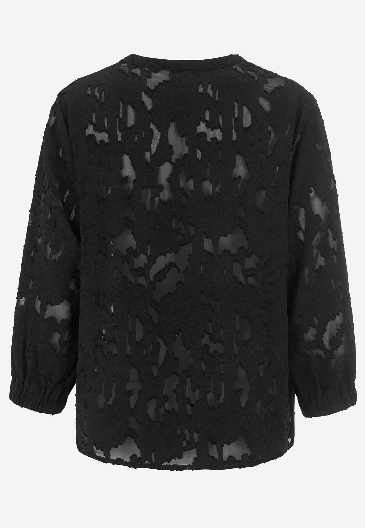 Jacquard-neuloksinen, läpikuultava pusero