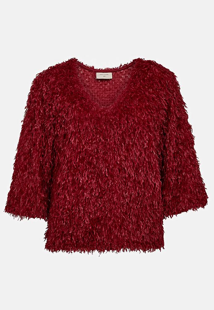 Juhlatoppi höyhenenkaltaisella materiaalilla