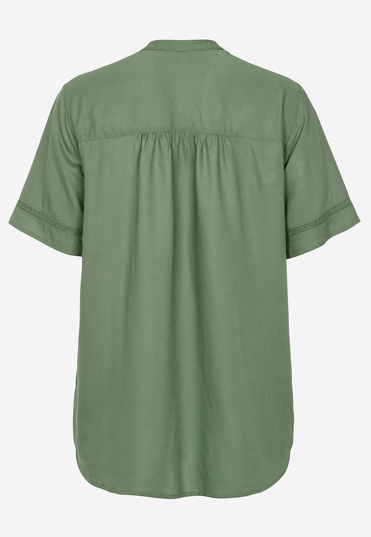 Kudottu tunika pitsireunuksilla